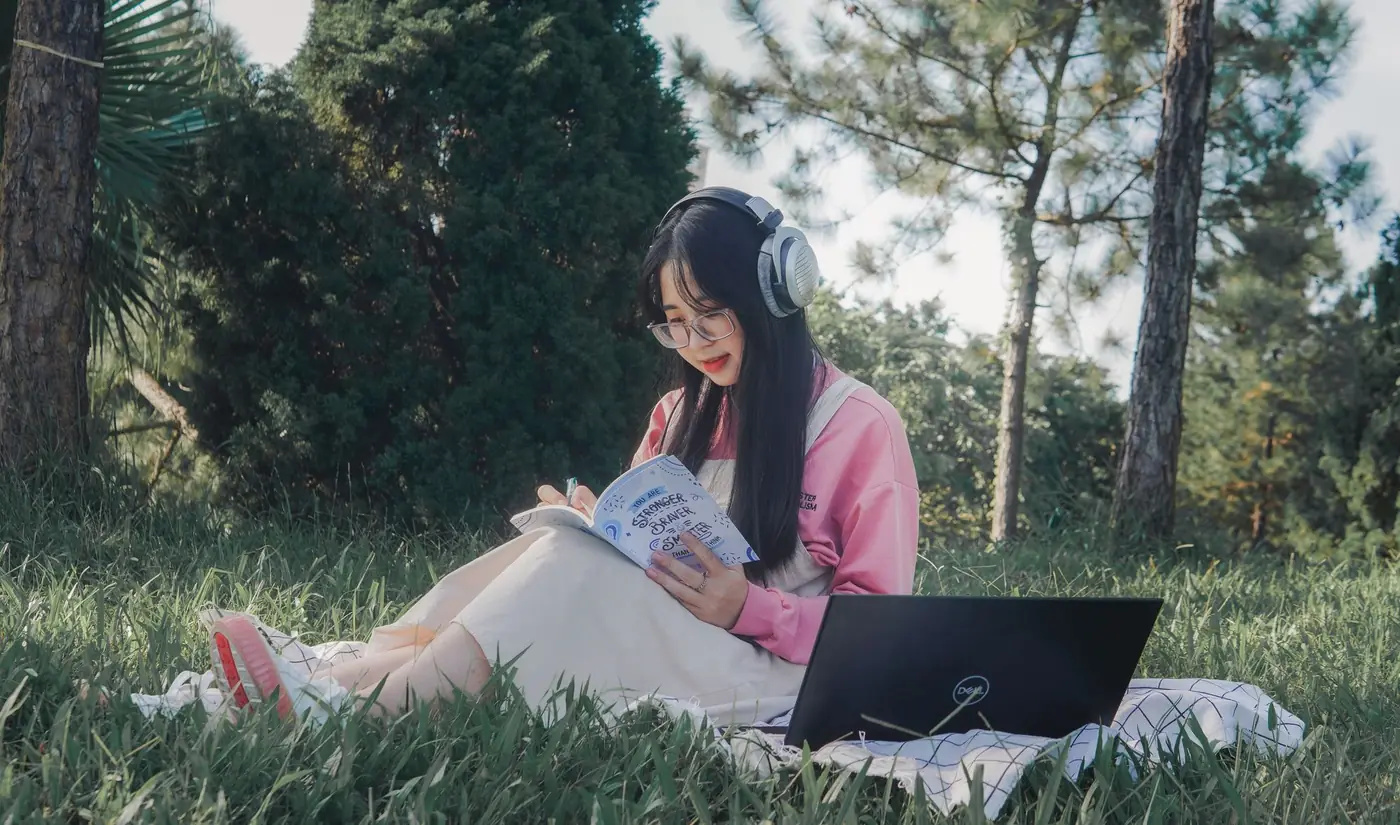 A student studying outdoors